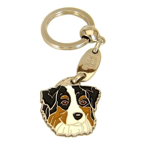 <h3>Custom personalized dog name tag Australian shepherd tricolor</h3>
This unique, cute and quality dog id tag is offered with laser-engraved name and phone number or your custom text. It comes with a stainless steel split ring for easy attachment to your pet’s collar. All items are also available as keychains.
A perfect gift for dogs and dog lovers.

<strong>Color:</strong> colored/silver
<strong>Size:</strong> 29 x 30 mm (1.14 x 1.18 inch)
<strong>Engraving area:</strong> 20 x 18 mm (0.79 x 0.71 inch); recommended layout up to 4 lines, 15 characters per line.

Laser engraving on the back side is included in the price. Please enter the text you would like engraved (recommended: dog’s name and phone number). The engraving will be centered and easy to read. 
<strong>Important:</strong> If you exceed the recommended text length, the engraving will be significantly smaller and may become difficult to read. For best readability, we strongly recommend keeping the text short and clear.

Metal, chrome plated dog tag or key ring. 
Hand made, hand colored, made in Slovenia. 

In stock.

<h3>About the breed – Australian shepherd tricolor</h3>
<section>
<h2>Australian Shepherd (Aussie): Characteristics & Care</h2>
<p>The <strong>Australian Shepherd</strong> (Aussie) is a medium-sized, highly intelligent and energetic dog breed that was developed in the United States despite its name. It belongs to the <strong>FCI Group 1 (Sheepdogs and Cattle Dogs)</strong>. Known for its striking coat patterns, often with merle coloring, and expressive eyes, it was bred as a <strong>working and herding dog</strong>.</p>
<h3>Temperament and Family Life</h3>
<p>Australian Shepherds are extremely loyal, affectionate with their families, and excellent with children when properly socialized. They are <strong>alert, attentive, and protective</strong>, making them reliable watchdogs, while remaining friendly and devoted. Their high intelligence and eagerness to please make them highly trainable, though they require consistent mental stimulation.</p>
<h3>Physical Requirements & Exercise</h3>
<p>To live a healthy and fulfilled life, an Australian Shepherd needs:</p>
<ul>
<li><strong>Daily Exercise:</strong> Intensive physical activity, long walks, running, and challenging tasks.</li>
<li><strong>Environment:</strong> An active home with space and opportunities for work or play.</li>
<li><strong>Grooming:</strong> Regular brushing of the medium-length <strong>double coat</strong> to maintain its condition.</li>
</ul>
<p><strong>Pro Tip:</strong> A personalized engraved dog tag enhances the Aussie’s distinctive look while providing a practical and stylish form of identification.</p>
</section>

