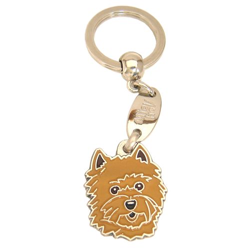 <h3>Custom personalized dog name tag Cairn terrier red</h3>
This unique, cute and quality dog id tag is offered with laser-engraved name and phone number or your custom text. It comes with a stainless steel split ring for easy attachment to your pet’s collar. All items are also available as keychains.
A perfect gift for dogs and dog lovers.

<strong>Color:</strong> colored/silver
<strong>Size:</strong> 26 x 32 mm (1.02 x 1.26 inch)
<strong>Engraving area:</strong> 19 x 19 mm (0.75 x 0.75 inch); recommended layout up to 4 lines, 15 characters per line.

Laser engraving on the back side is included in the price. Please enter the text you would like engraved (recommended: dog’s name and phone number). The engraving will be centered and easy to read. 
<strong>Important:</strong> If you exceed the recommended text length, the engraving will be significantly smaller and may become difficult to read. For best readability, we strongly recommend keeping the text short and clear.

Metal, chrome plated dog tag or key ring. 
Hand made, hand colored, made in Slovenia. 

In stock.

<h3>About the breed – Cairn terrier red</h3>
<section>
<h2>Cairn Terrier: Characteristics & Care</h2>
<p><strong>Cairn Terrier</strong> is a small, energetic, and brave dog breed originating from Scotland. It belongs to the <strong>FCI Group 3 (Terriers)</strong>. Bred as a <strong>working and family dog</strong>, it is known for its rough, weather-resistant coat, lively expression, and fearless character.</p>
<h3>Temperament and Family Life</h3>
<p>Cairn Terriers are very affectionate family dogs, good with children and strongly attached to their owners. They are <strong>alert, intelligent, and curious</strong>, which makes them good watchdogs while remaining friendly and adaptable. Their playful and confident nature suits active families and both house and apartment living.</p>
<h3>Physical Requirements & Exercise</h3>
<p>To live a healthy and happy life, a Cairn Terrier needs:</p>
<ul>
    <li><strong>Daily Exercise:</strong> Regular activity, play, and exploration.</li>
    <li><strong>Environment:</strong> A safe space and plenty of mental stimulation.</li>
    <li><strong>Grooming:</strong> Regular brushing of the harsh <strong>double coat</strong>.</li>
</ul>
<p><strong>Pro Tip:</strong> A <strong>personalized engraved dog tag</strong> highlights the distinctive and brave look of your Cairn Terrier while being a practical and stylish accessory.</p>
</section>
