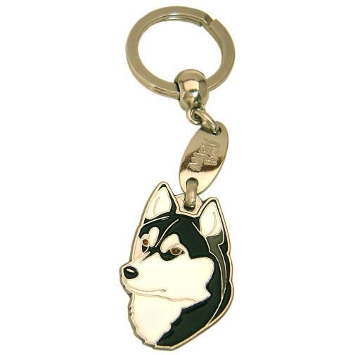<h3>Custom personalized dog name tag Siberian husky black, brown eyes</h3>
This unique, cute and quality dog id tag is offered with laser-engraved name and phone number or your custom text. It comes with a stainless steel split ring for easy attachment to your pet’s collar. All items are also available as keychains.
A perfect gift for dogs and dog lovers.

<strong>Color:</strong> colored/silver
<strong>Size:</strong> 26 x 36 mm (1.02 x 1.42 inch)
<strong>Engraving area:</strong> 18 x 22 mm (0.71 x 0.87 inch); recommended layout up to 4 lines, 15 characters per line.

Laser engraving on the back side is included in the price. Please enter the text you would like engraved (recommended: dog’s name and phone number). The engraving will be centered and easy to read. 
<strong>Important:</strong> If you exceed the recommended text length, the engraving will be significantly smaller and may become difficult to read. For best readability, we strongly recommend keeping the text short and clear.

Metal, chrome plated dog tag or key ring. 
Hand made, hand colored, made in Slovenia. 

In stock.

<h3>About the breed – Siberian husky black, brown eyes</h3>
<section>
<h2>Siberian Husky: Characteristics & Care</h2>
<p>The <strong>Siberian Husky</strong> is a medium-sized, resilient, and energetic dog breed originating from northeastern Asia. It belongs to the <strong>FCI Group 5 (Spitz and Primitive Types)</strong>. It was bred as a <strong>sled dog</strong>, known for its exceptional endurance, speed, and ability to work in harsh weather conditions.</p>
<h3>Temperament and Family Life</h3>
<p>Siberian Huskies are friendly, social, and very attached to people, making them excellent family dogs and great with children. They are <strong>alert, intelligent, and playful</strong>, but not typical watchdogs as they are often friendly toward strangers. Their energetic and independent nature requires consistent training and an active lifestyle.</p>
<h3>Physical Requirements & Exercise</h3>
<p>To live a healthy and happy life, a Siberian Husky needs:</p>
<ul>
    <li><strong>Daily Exercise:</strong> Plenty of running, activity, and mental stimulation.</li>
    <li><strong>Environment:</strong> Space to move and a cooler climate that suits them.</li>
    <li><strong>Grooming:</strong> Regular brushing of the thick <strong>double coat</strong>, especially during shedding.</li>
</ul>
<p><strong>Pro Tip:</strong> A <strong>personalized engraved dog tag</strong> beautifully highlights the sporty and elegant appearance of your Siberian Husky while serving as a practical and stylish accessory.</p>
</section>
