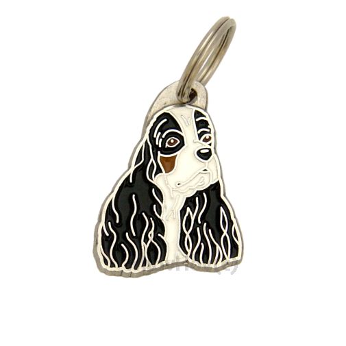 <h3>Custom personalized dog name tag American cocker spaniel tricolor</h3>
This unique, cute and quality dog id tag is offered with laser-engraved name and phone number or your custom text. It comes with a stainless steel split ring for easy attachment to your pet’s collar. All items are also available as keychains.
A perfect gift for dogs and dog lovers.

<strong>Color:</strong> colored/silver
<strong>Size:</strong> 24 x 34 mm (0.94 x 1.34 inch)
<strong>Engraving area:</strong> 17 x 13 mm (0.67 x 0.51 inch); recommended layout up to 4 lines, 15 characters per line.

Laser engraving on the back side is included in the price. Please enter the text you would like engraved (recommended: dog’s name and phone number). The engraving will be centered and easy to read. 
<strong>Important:</strong> If you exceed the recommended text length, the engraving will be significantly smaller and may become difficult to read. For best readability, we strongly recommend keeping the text short and clear.

Metal, chrome plated dog tag or key ring. 
Hand made, hand colored, made in Slovenia. 

In stock.

<h3>About the breed – American cocker spaniel tricolor</h3>
<section>
<h2>American Cocker Spaniel Dog Breed Profile: Characteristics & Care</h2>
<p>The <strong>American Cocker Spaniel</strong> (also known as Cocker Spaniel American type) is a charming, affectionate, and impressive companion breed admired for its silky coat and expressive eyes. It belongs to the <strong>FCI Group 8 (Retrievers, Flushing Dogs, and Water Dogs)</strong>. Originally bred as a <strong>hunting dog</strong>, it has become a popular family dog known for its friendly nature and adaptability. Its compact size, long ears, and luxurious coat give it a distinctive and elegant appearance.</p>
<h3>Temperament and Family Life</h3>
<p>American Cocker Spaniels are loving family dogs that are excellent with children and thrive in social environments. They are <strong>alert, gentle, and sociable</strong>, making them reliable yet friendly watchdogs. Their sensitive and people-oriented personality helps them form strong emotional bonds with their owners. Playful and persistent, they bring joy, warmth, and lively energy into everyday life.</p>
<h3>Physical Requirements & Exercise</h3>
<p>To keep an American Cocker Spaniel healthy and happy, owners should provide:</p>
<ul>
    <li><strong>Daily Exercise:</strong> Moderate activity including walks, playtime, and mental stimulation.</li>
    <li><strong>Space:</strong> A comfortable home environment with regular interaction and companionship.</li>
    <li><strong>Grooming:</strong> Regular brushing and maintenance of their long, silky <strong>coat</strong>.</li>
</ul>
<p><strong>Pro Tip:</strong> A <strong>personalized engraved dog tag</strong> is a stylish accessory that enhances your American Cocker Spaniel’s elegant look while ensuring safety on every outing.</p>
</section>
